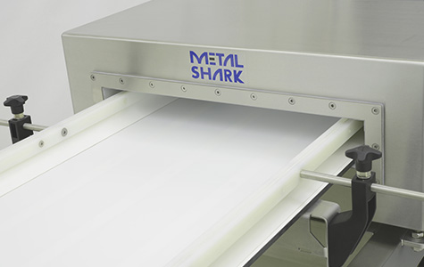 A close-up view of a Metal Shark metal detector for conveyors.
